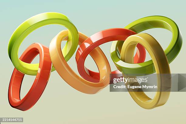 intertwined colorful rings creating a dynamic and playful composition - intertwine abstract stock pictures, royalty-free photos & images