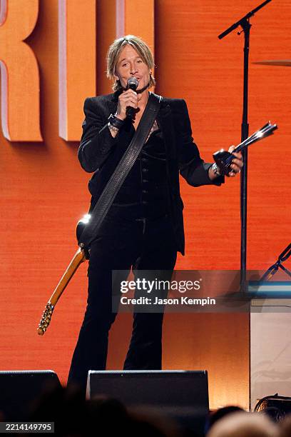 Honoree Keith Urban accepts the ACM Triple Crown Award onstage during the 60th Academy of Country Music Awards at The Ford Center at The Star on May...