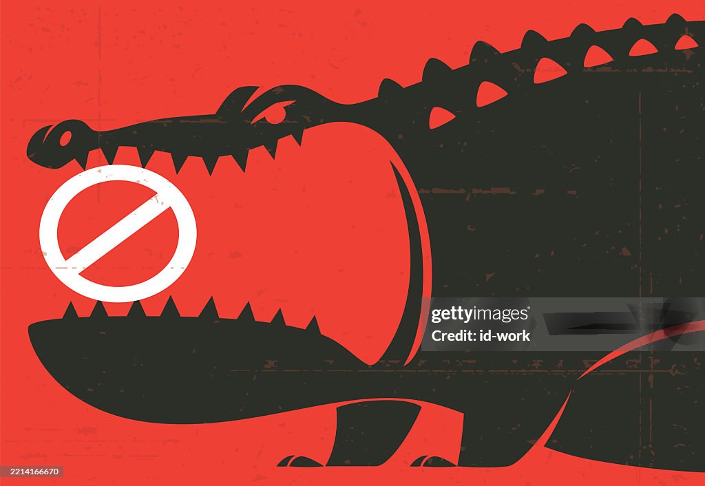 Angry crocodile holding prohibition warning sign