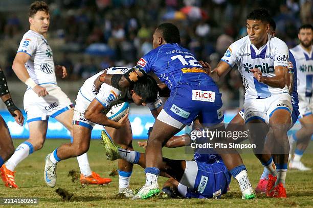 Xavi Taele of the Blues is tackled during the round 13 Super Rugby Pacific match between Fijian Drua and Blues at HFC Stadium, on May 09 in Suva,...