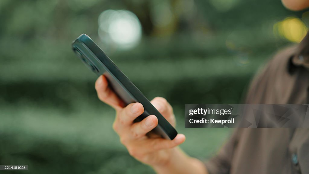 Asian man using smartphone in resting time