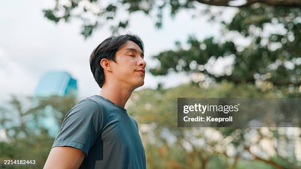 Man Inhaling Asian Man Breathing Inhaling Good Air High-Res Stock Photo - Getty Images