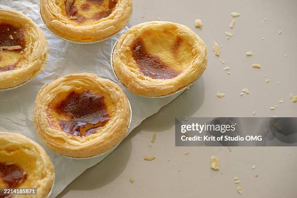 freshly baked custard tarts on neutral background - omg stock pictures, royalty-free photos & images