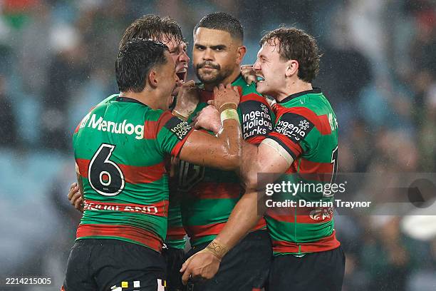 Latrell Mitchell of the Rabbitohs celebrates with team mates after kicking a two-point field goal during the round 10 NRL match between the South...