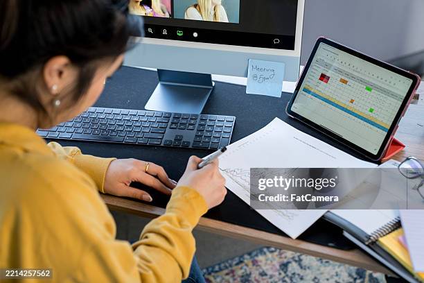 analyzing graph data on paper while working at a desk - multiple choice computer stock pictures, royalty-free photos & images