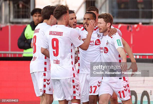 Florian Kainz of 1.FC Koln celebrates scoring his team's first goal with teammates during the Second Bundesliga match between 1. FC Nürnberg and 1....