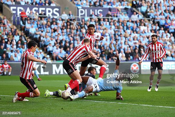 Brandon Thomas-Asante of Coventry City misses a chance as he is challenged by Daniel Ballard of Sunderland during the Sky Bet Championship Play-Off...