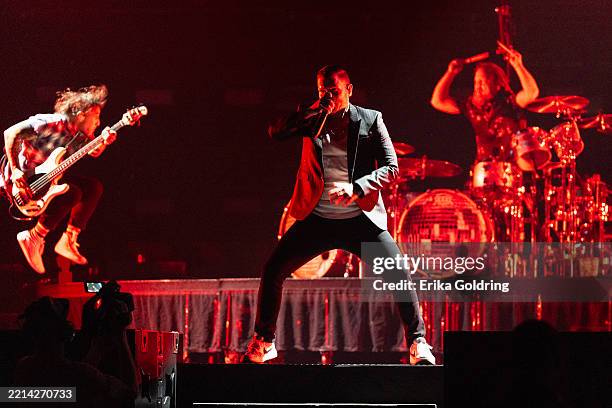 Zach Myers, Brent Smith and Barry Kerch of Shinedown perform at Smoothie King Center on May 06, 2025 in New Orleans, Louisiana.