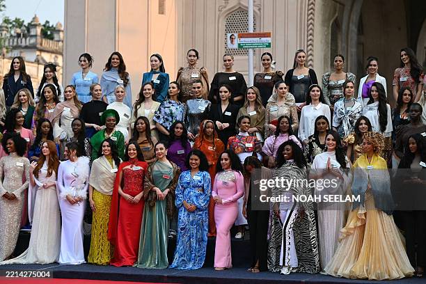 Contestants of the Miss World 2025 pageant pose in front of the Charminar during a heritage walk as part of the 72nd Miss World 2025, in Hyderabad on...