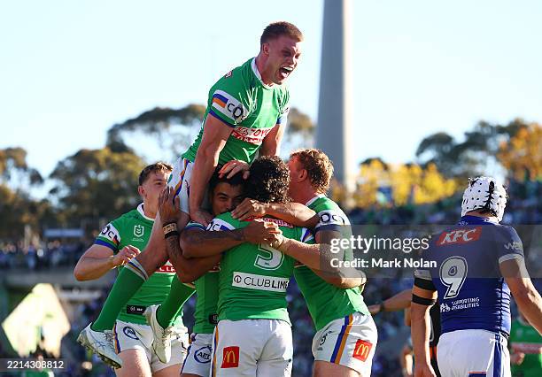 Xavier Savage of the Raiders celebrates a try with team mates during the round 10 NRL match between Canberra Raiders and Canterbury Bulldogs at GIO...