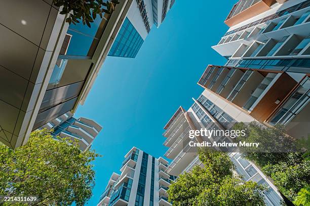 suburb with apartments trees blue sky - wide shot stock pictures, royalty-free photos & images