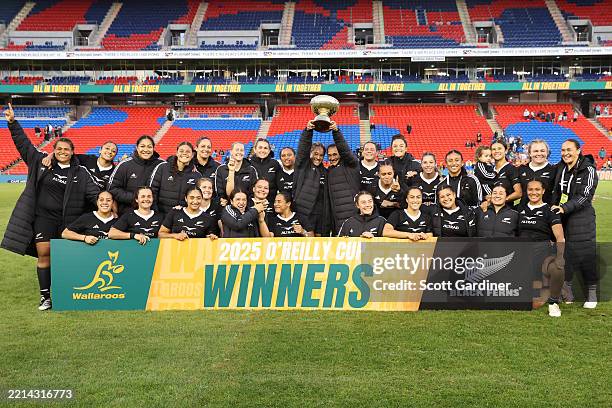 Ferns players celebrate with the O'Reilly Cup following their victory during the Pacific Four Series International Match between Australia Wallaroos...