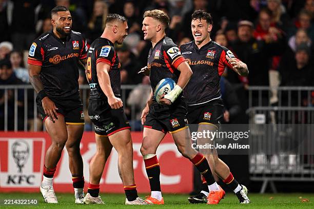 Damian McKenzie of the Chiefs celebrates after scoring a try during the round 13 Super Rugby Pacific match between Crusaders and Chiefs at Apollo...