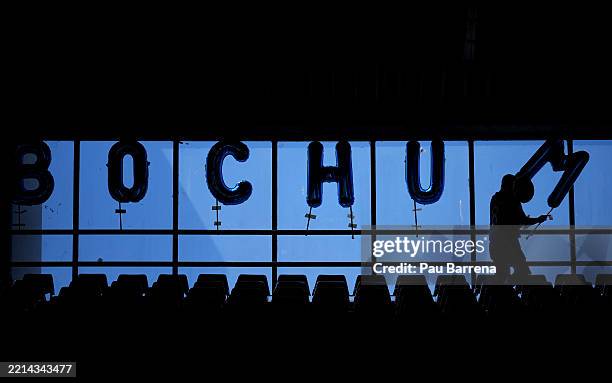Fan of of VfL Bochum 1848 arranges balloons in the stands prior to the Bundesliga match between VfL Bochum 1848 and 1. FSV Mainz 05 at Vonovia...
