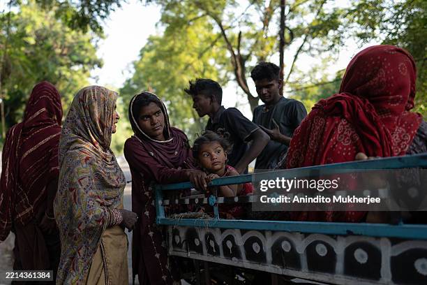 Family is pictured in transit as they relocate from areas near the India-Pakistan border to a safer place on May 10, 2025 in Jammu, India.Tensions...