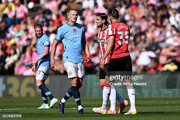 Erling Haaland of Manchester City clashes with Jan Bednarek of Southampton during the Premier League match between Southampton FC and Manchester City...