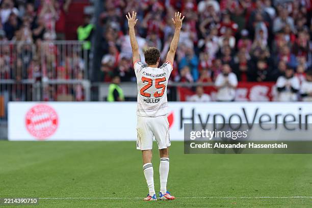 Thomas Mueller of Bayern Munich acknowledges the fans, as he leaves the pitch on his final home game for the team during the Bundesliga match between...