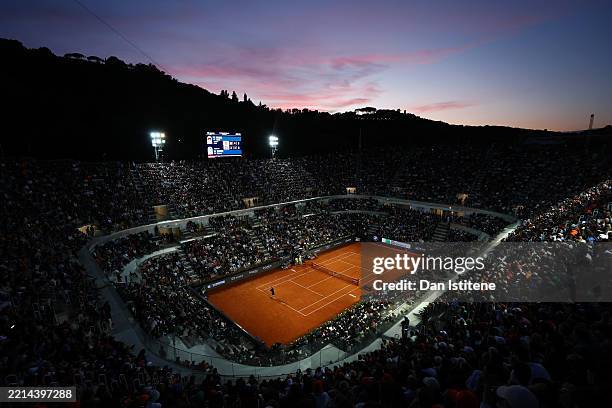 General view of centre court at sunset as Jannik Sinner of Italy serves in his Men's Singles Second Round match against Mariano Navone of Argentina...