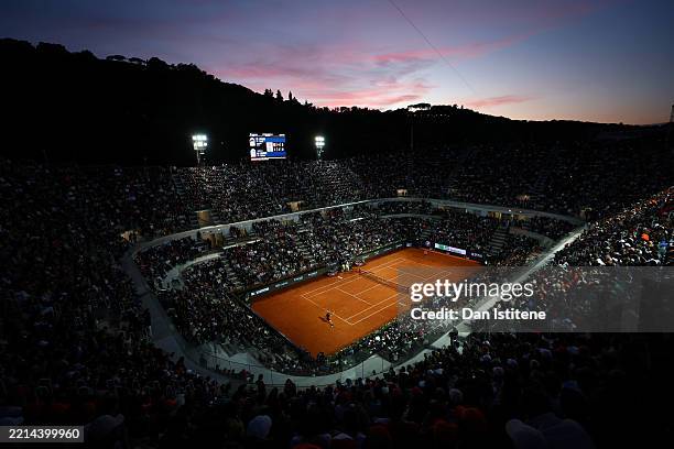 General view of centre court at sunset as Jannik Sinner of Italy hits a forehand in his Men's Singles Second Round match against Mariano Navone of...