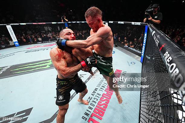Jack Della Maddalena of Australia knees Belal Muhammad in the UFC welterweight championship bout during the UFC 315 event at Bell Centre on May 10,...