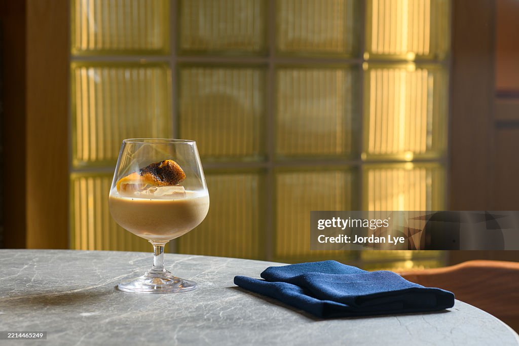 Baileys cocktail glass serve on dining table in the luxury restaurant