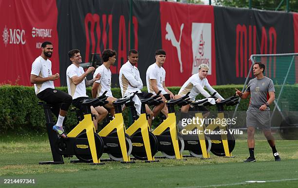 Players of AC Milan look on during a AC Milan training session at Milanello on May 11, 2025 in Cairate, Italy.