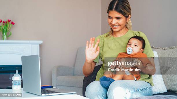 young mother talking on video call with her doctor - type 1 diabetes stock pictures, royalty-free photos & images