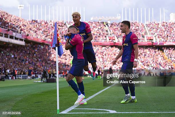 Raphinha of FC Barcelona celebrates scoring his team's third goal with teammates Ferran Torres and Lamine Yamal during the LaLiga match between FC...