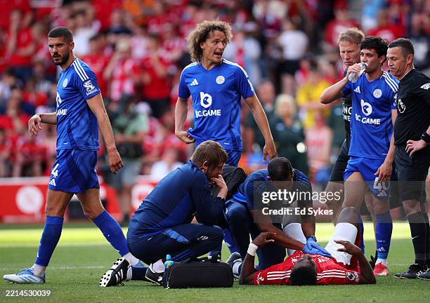 Taiwo Awoniyi of Nottingham Forest receives medical treatment during the Premier League match between Nottingham Forest FC and Leicester City FC at...