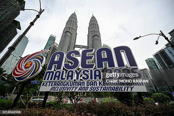 The logo of the Association of Southeast Asian Nations is pictured in front of Malaysia's Petronas Twin Towers in Kuala Lumpur on May 15, 2025.
