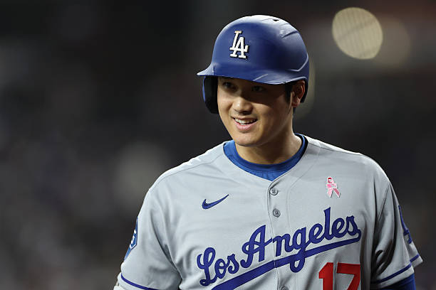 Shohei Ohtani of the Los Angeles Dodgers reacts on deck during the first inning of the MLB game against the Arizona Diamondbacks at Chase Field on...