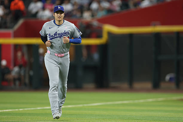 Shohei Ohtani of the Los Angeles Dodgers warms up before the MLB game against the Arizona Diamondbacks at Chase Field on May 11, 2025 in Phoenix,...