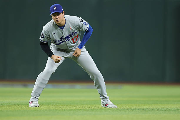 Shohei Ohtani of the Los Angeles Dodgers warms up before the MLB game against the Arizona Diamondbacks at Chase Field on May 11, 2025 in Phoenix,...