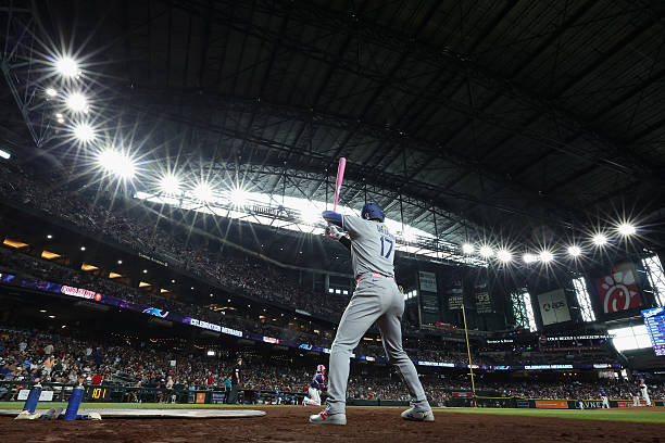 Shohei Ohtani of the Los Angeles Dodgers warms up on deck during the fifth inning of the MLB game against the Arizona Diamondbacks at Chase Field on...