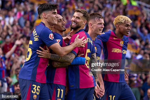 Raphinha of FC Barcelona celebrates with his teammates Gerard Martin, Inigo Martinez, Dani Olmo and Lamine Yamal after scoring their team's fourth...