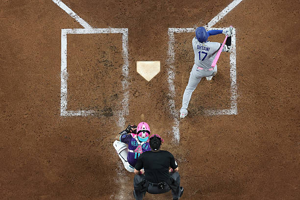 Shohei Ohtani of the Los Angeles Dodgers hits a single against the Arizona Diamondbacks during the sixth inning of the MLB game at Chase Field on May...
