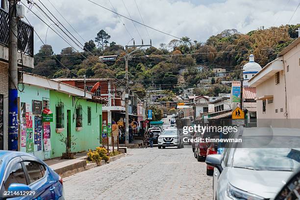 vibrant street in ataco, a historic colonial village in el salvador central america - el salvador stock pictures, royalty-free photos & images