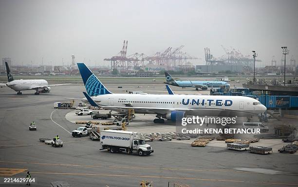 United plane is parked at the gate at Newark Liberty International Airport in Newark, New Jersey on May 7, 2025. Regulators have been slowing...