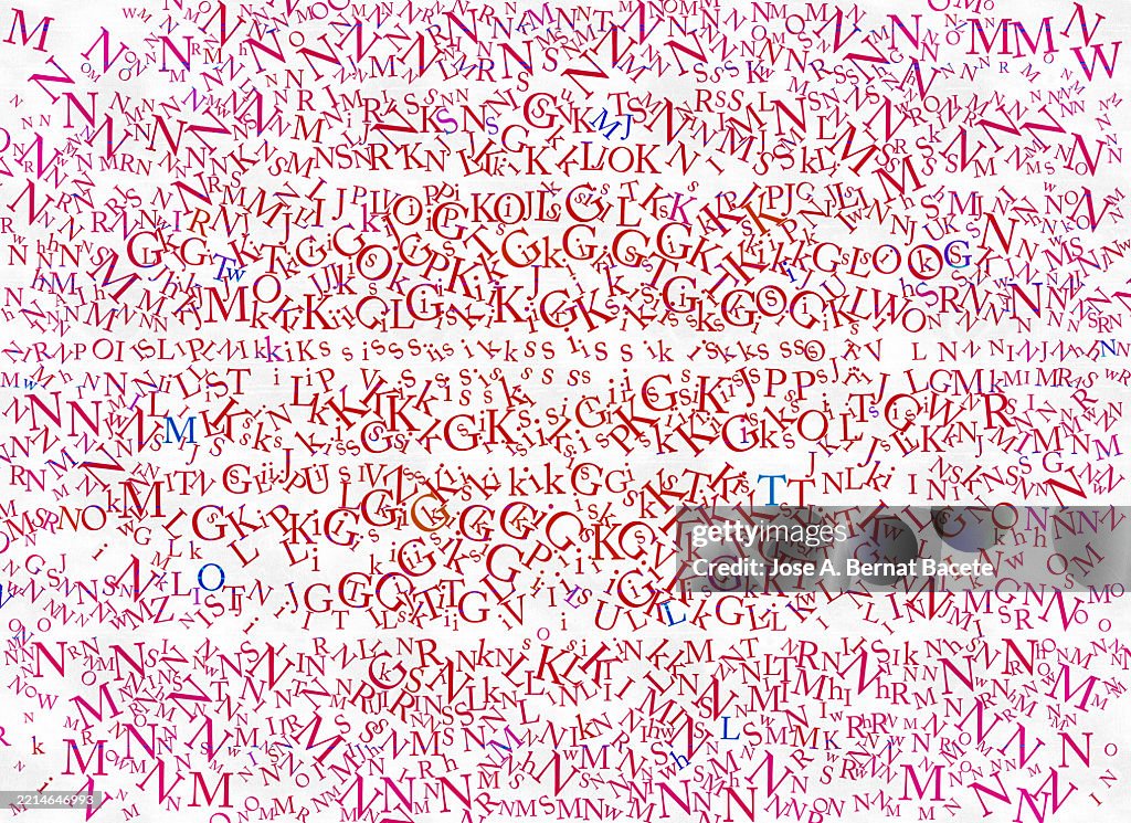 Abstract background, jumbled alphabet letters on a white paper background.