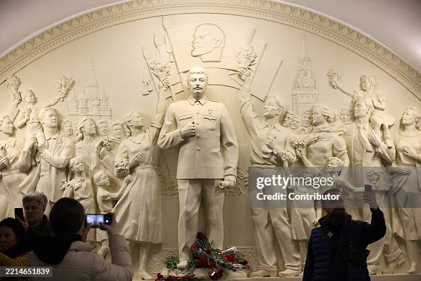 People take selfie photo of a new monument to former Soviet leader Joseph Stalin at Taganskaya Metro station, May 15, 2025 in Moscow, Russia. A...