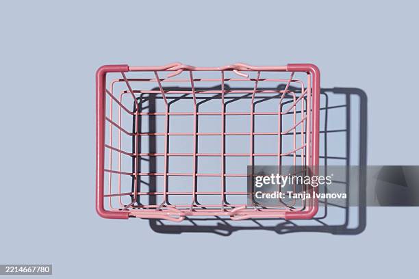 empty shopping basket on blue background. shopping and sale concept. - shopping basket stock pictures, royalty-free photos & images