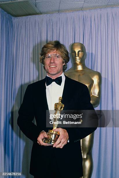 American actor Robert Redford holding his Oscar trophy backstage during the 53rd Annual Academy Awards at the Dorothy Chandler Pavilion in Los...