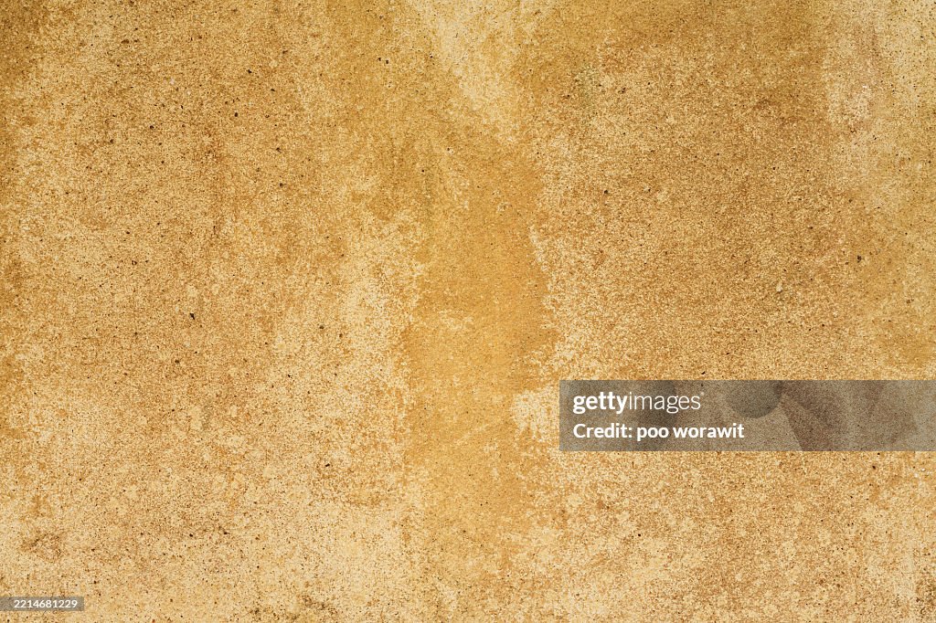 Yellow cement wall .