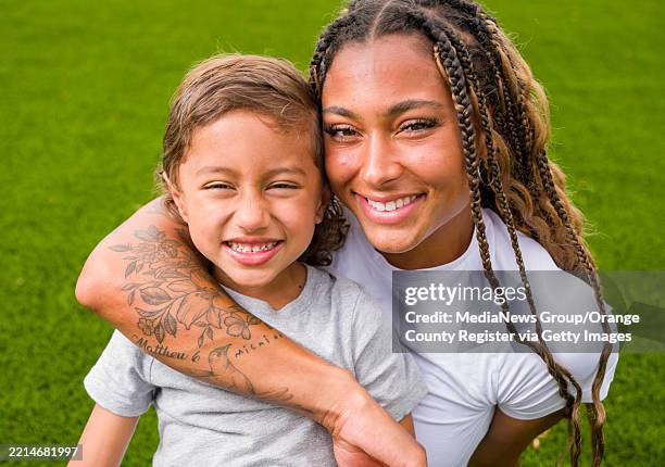 Irvine track and field athlete Jolie Robinson with her son Micaiah on the UCI campus in Irvine on Thursday, May 1, 2025. Robinson tattooed Micaiah's...