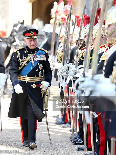 King Charles III inspects soldiers after the presentation of the New Standards at Windsor Castle on May 12, 2025 in Windsor, England. The King,...