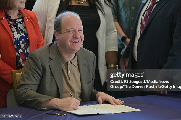 Governor Jared Polis signed three different bills into law on his 50th birthday at the Governor's Residence at Boettcher Mansion in Denver, Colorado...