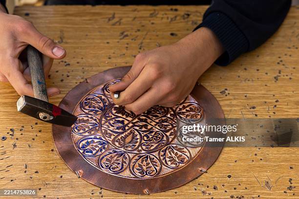 artisans handcraft copper, a master craftsman in the copper bazaar. - storefront-for-art-and-architecture stock pictures, royalty-free photos & images