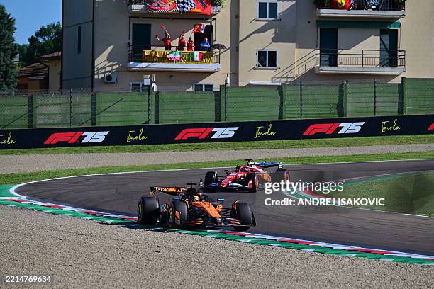 McLaren's Australian driver Oscar Piastri races ahead of Ferrari's Monegasque driver Charles Leclerc during the second practice session for the 2025...