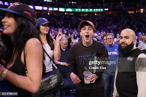 Kendall Jenner , Kylie Jenner and Timothee Chalamet celebrate during the fourth quarter in Game Four of the Eastern Conference Second Round NBA...