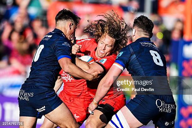 Scotland , United Kingdom - 16 May 2025; Werner Kok of Ulster is tackled by Magnus Bradbury and Ross Thompson of Edinburgh during the United Rugby...